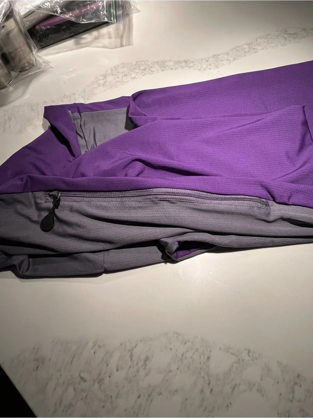 Nwt purple sholdit convertible infinity scarf with 10” long zippered pocket.